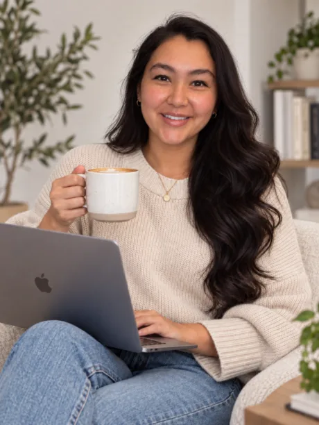 Alicia at home with a latte and laptop